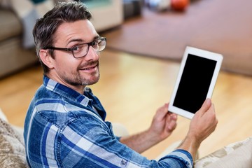 Portrait of man using a digital tablet