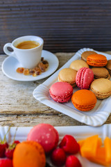 Macaroons - colored almond cookies with different flavors, French delights (filtered)
