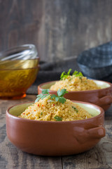 Couscous with vegetables on wood
