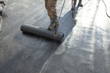 waterproofing roll bituminous material in the trench. constructi
