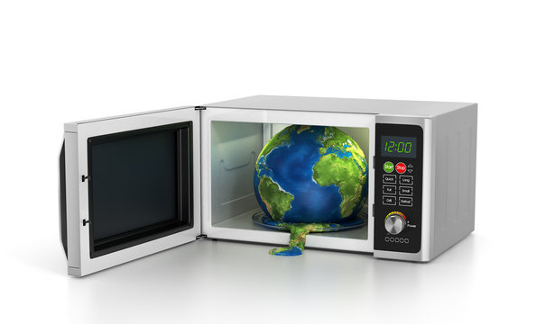 Global warming concept - earth in microwave.