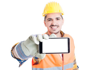 Joyful engineer holding a cell phone with blank screen