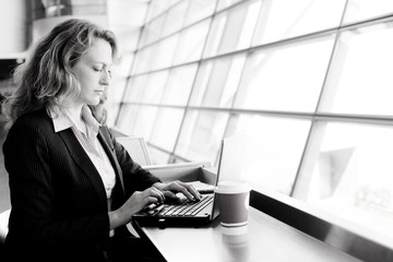 Portrait of beautiful 35 years old woman with laptop