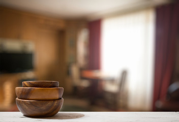 stack of empty wooden bowls on table