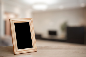 photo frame on the wooden table