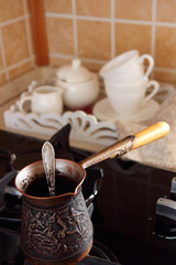 Brewed coffee Cezve and cup with sugar..