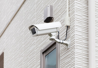 Video camera security system on the wall of the building..