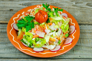 Mixed spring salad of vegetables on a  plate