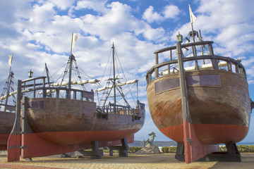 Ancient Spanish wooden ships and statue of a mermaid exposed on