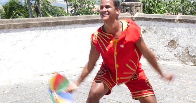 Young Brazilian man dancing Frevo in Olinda, Brazil
