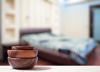stack of empty wooden bowls on table