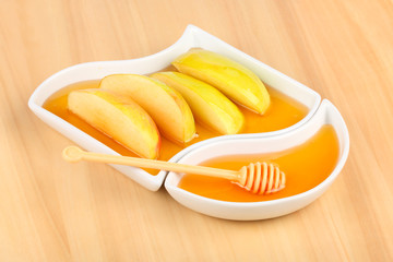 Dipping apples in honey