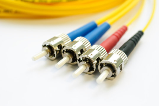 Four single-mode optical connectors st-type. front view.