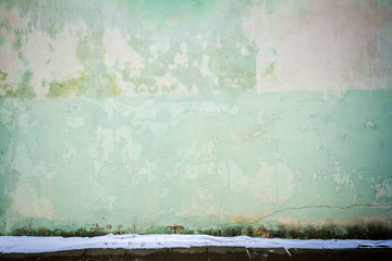 Green plaster street wall