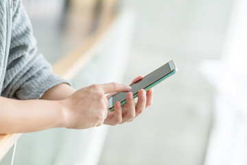 Man use of cellphone inside the building