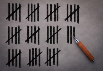 countdown with drawing on grey wall