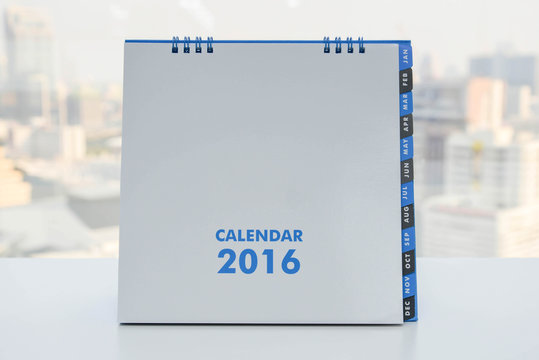 Calendar of 2016 on the white table with city view background