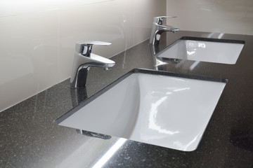 Modern style faucet with black granite counter top