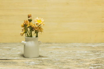 still life vintage vase with flowers background.