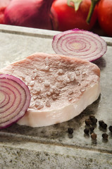 boneless pork chop on natural marble grill hot stone