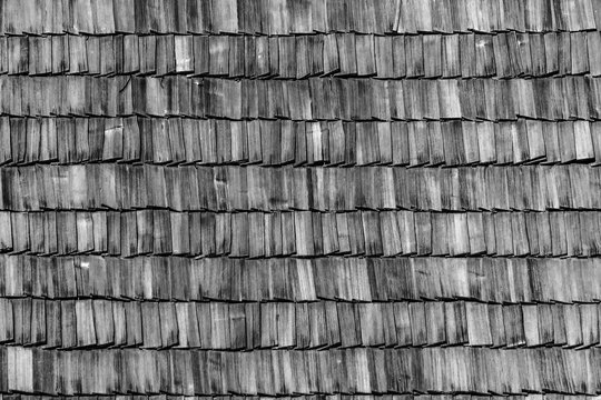 Background of old wood roof. Horizontal, monochrome picture, the theme - the elements of historic architecture.