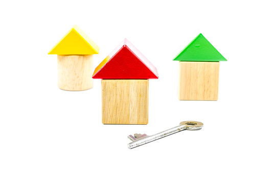 House wooden toy blocks with key isolated on white background,concept image