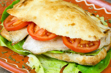 Beautiful spring sandwich on a clay plate