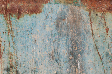 Old blue cracked paint on metal background