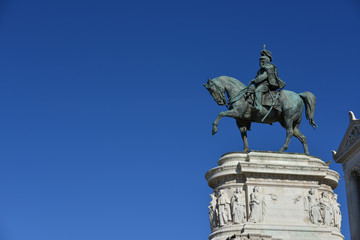 Fototapeta na wymiar Vittorio Emanuele II, first king of Italy (with copy space). ronze equestrian statue of the king of Italy from Vittoriano monumental altar in Rome.