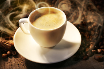 Obraz na płótnie Canvas Cup of coffee and grains, closeup