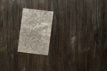 paper on old wooden background