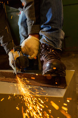 Worker working of a grinding machine