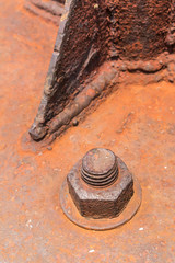 Old rusty metal nut locked with rust and corrosion old bolts.