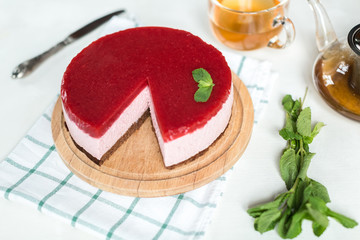 Delicious strawberry cheesecake on table