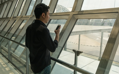 Man use smart phone in airport