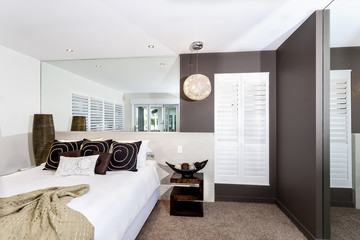 Modern bedroom with white sheets and pillows