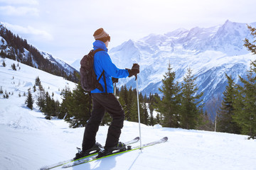 Skier enjoying beautiful view of alps mountains near chamonix, france