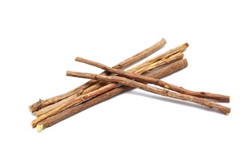 Liquorice root lying on a white background