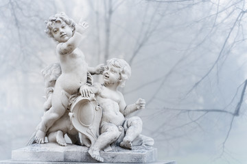 Statue of small boys in park. Vienna, Austria.