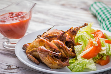 roast quail with salad and sauce