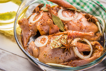 quail with spices in the marinade