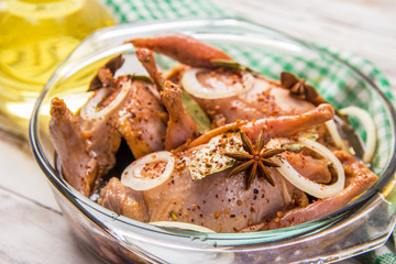 quail with spices in the marinade