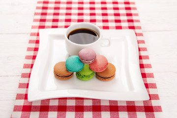 macaroon and a cup of coffee on the table