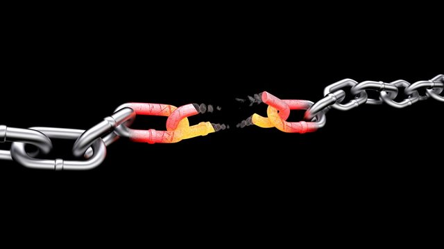 gap silver chain with a red-hot links in the middle of a black background.