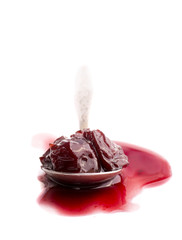 Cherry, cherry jam on a spoon. isolated white background.