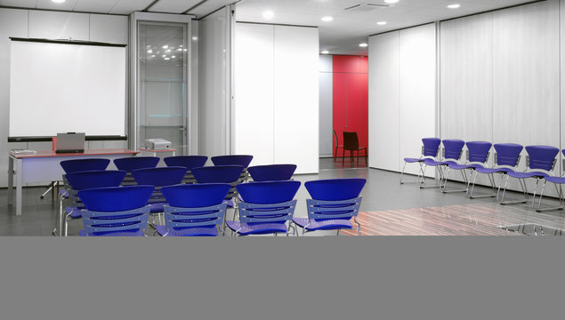Blue chairs in conference room