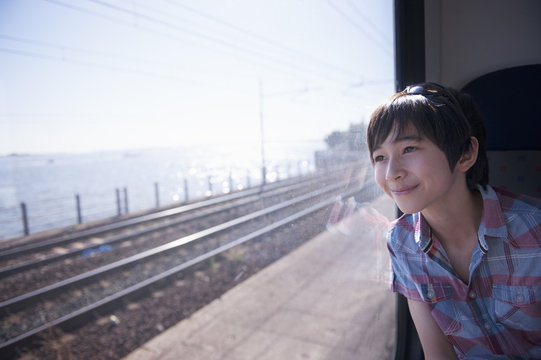 Boy looking out of train window