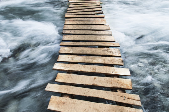Wooden boardwalk across water