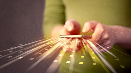 Person holding smarthphone with technology light applications