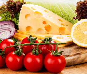 Still life with cheese on wooden board